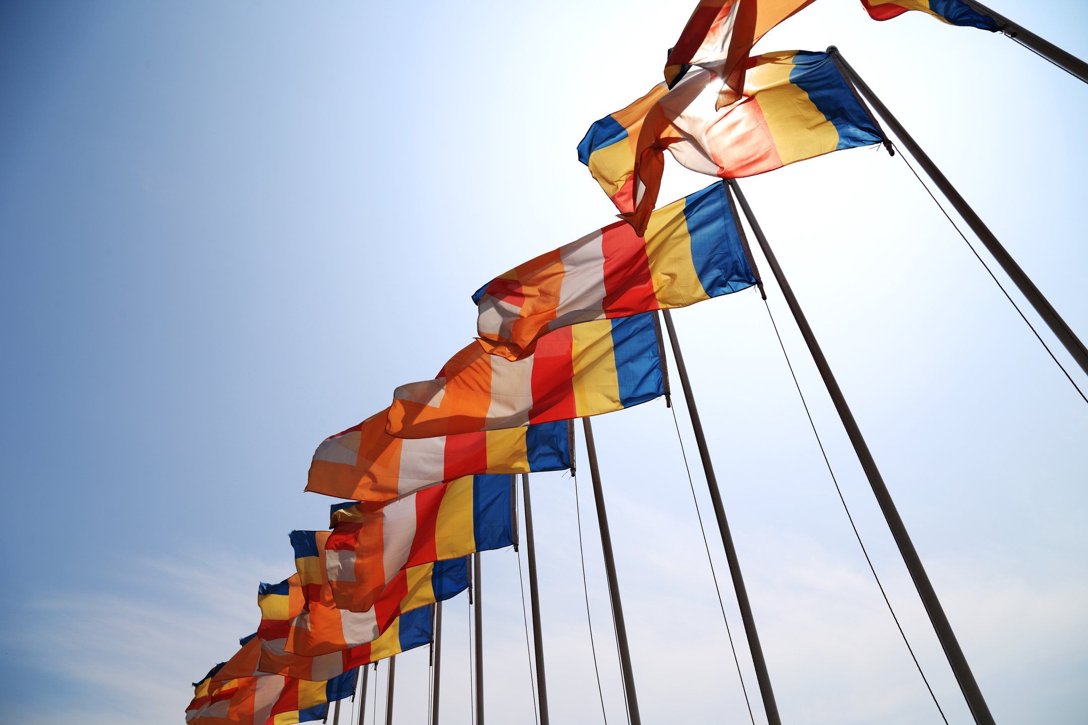 buddhist flag under the blue sky